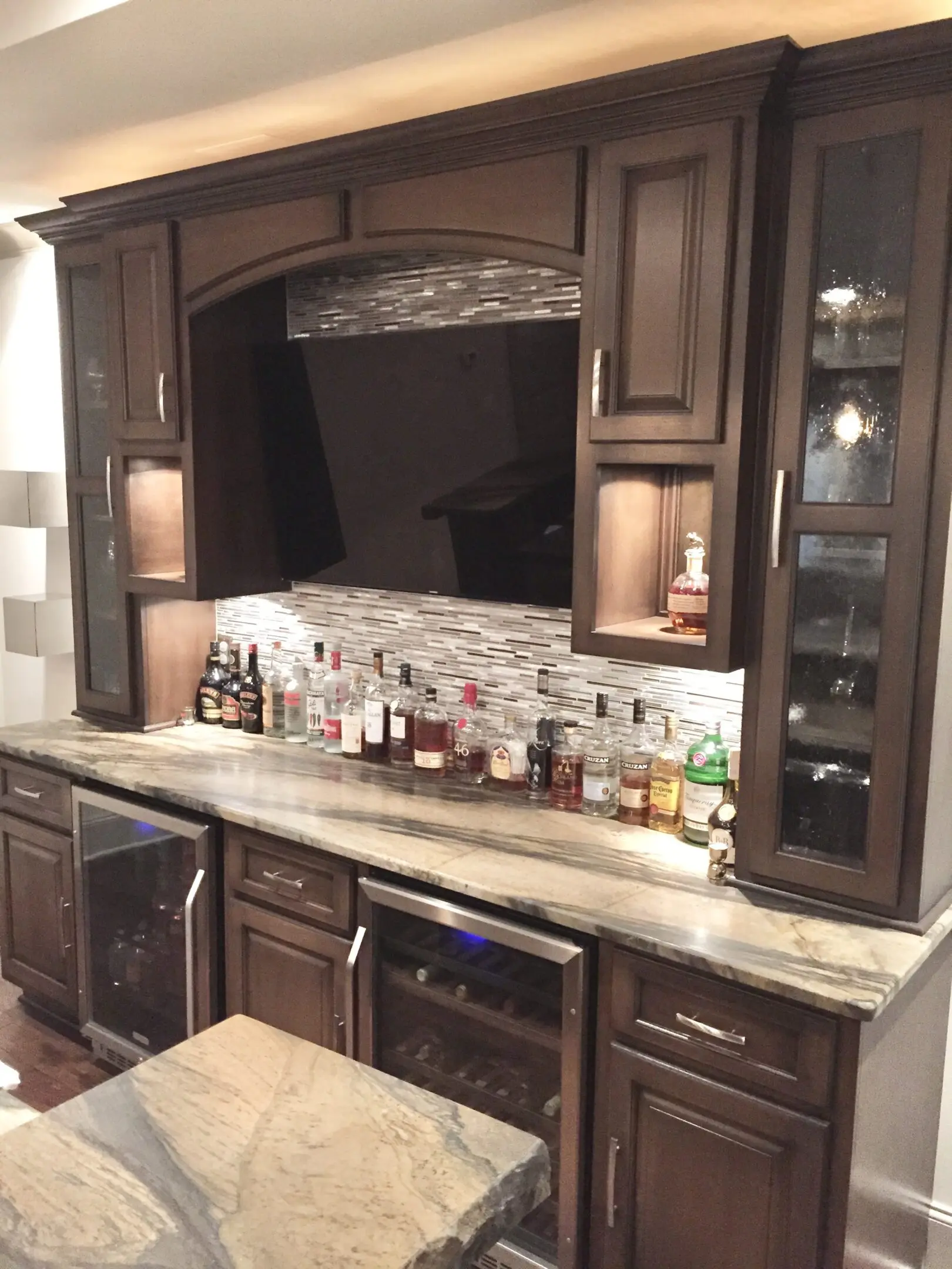 Cozy kitchen corner with wooden cabinets and granite countertop.