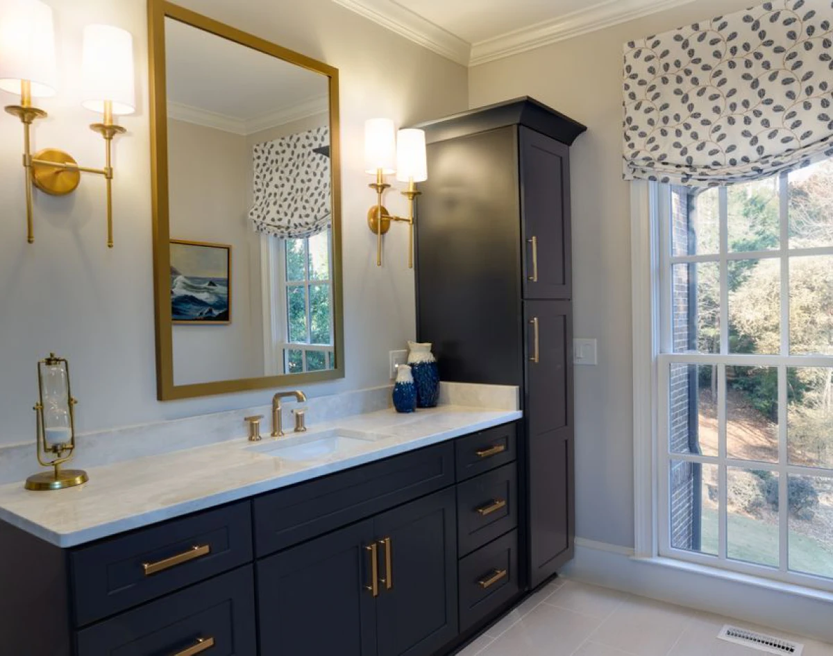 Bright bathroom featuring stylish light fixtures