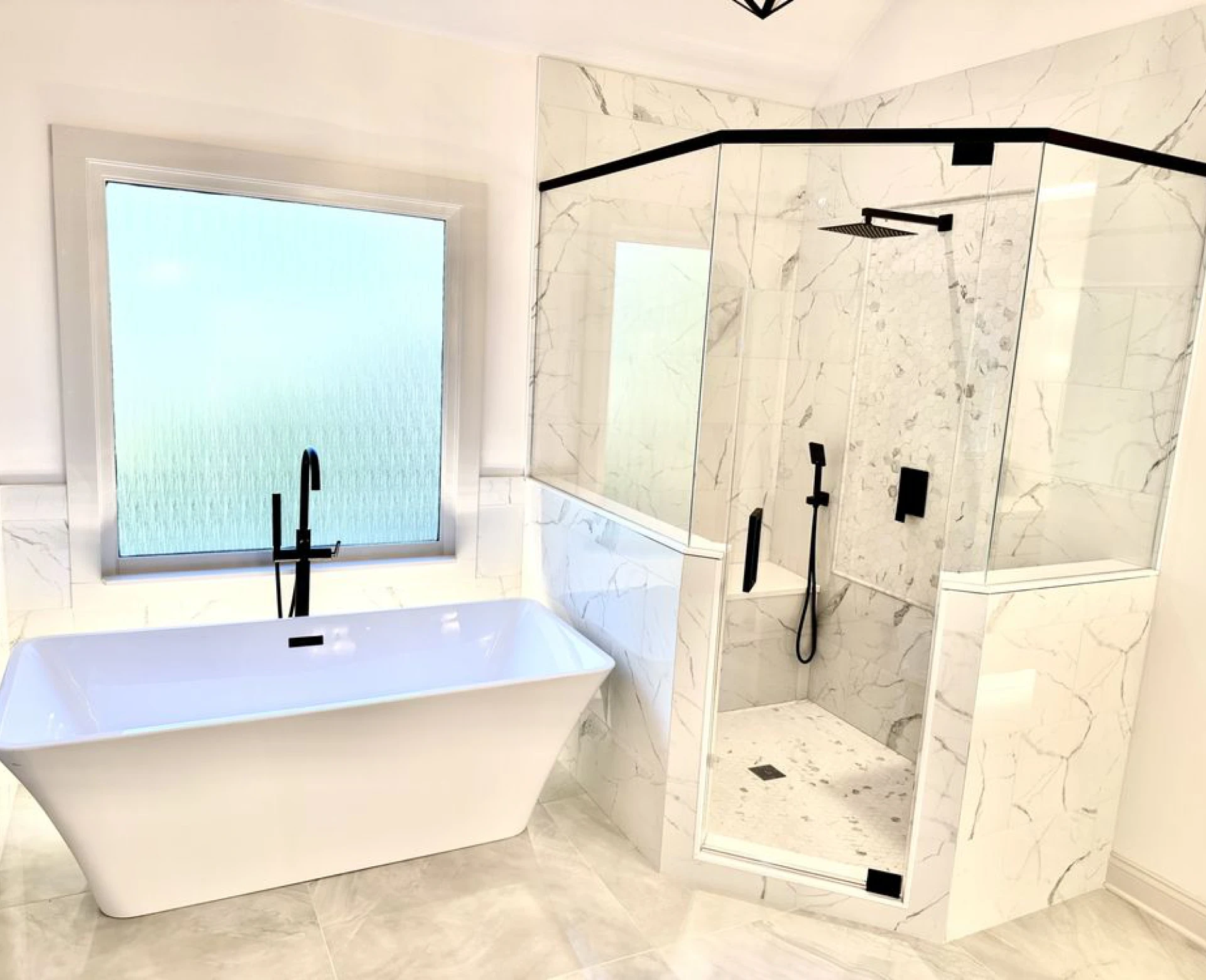 Bright bathroom featuring glass shower enclosure